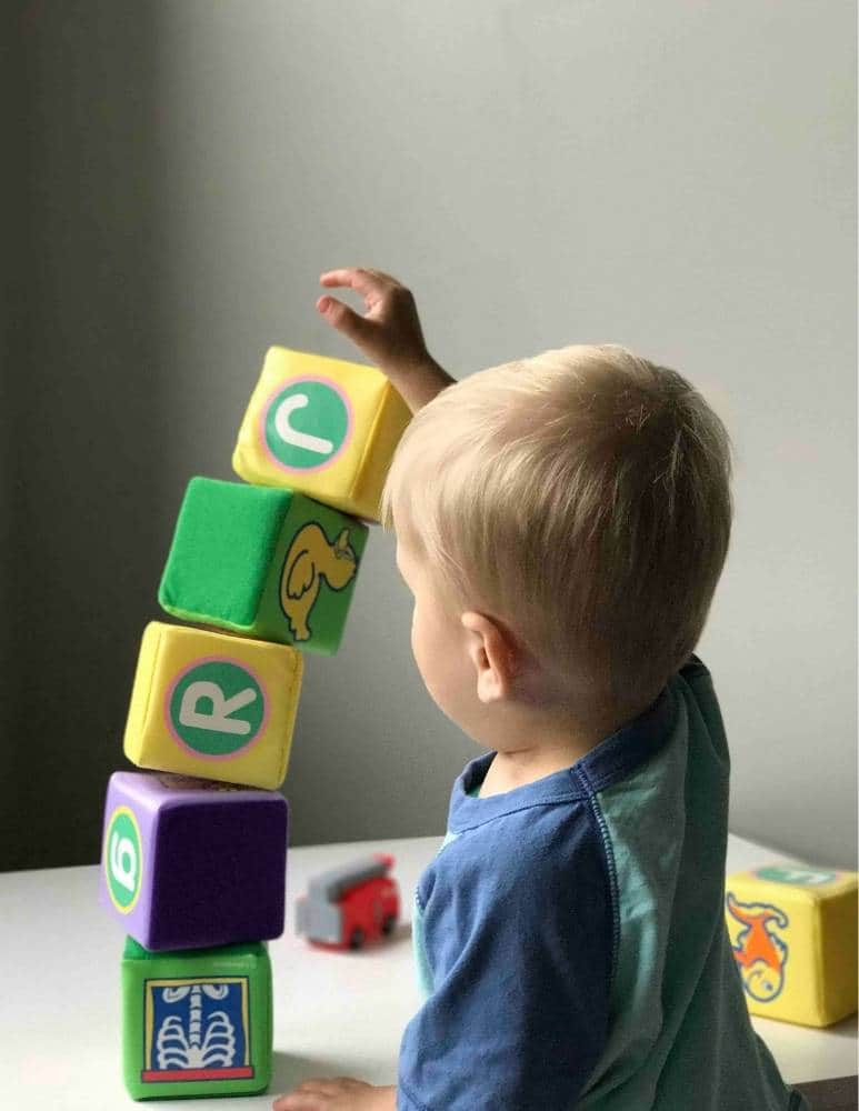 baby playing with toy